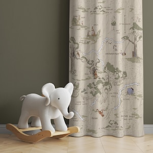 May include: A beige fabric curtain with a Winnie the Pooh map printed on it. The map shows the Hundred Acre Wood with locations like Pooh's house, Piglet's house, and the Bee Tree. A white rocking elephant toy is in the foreground.