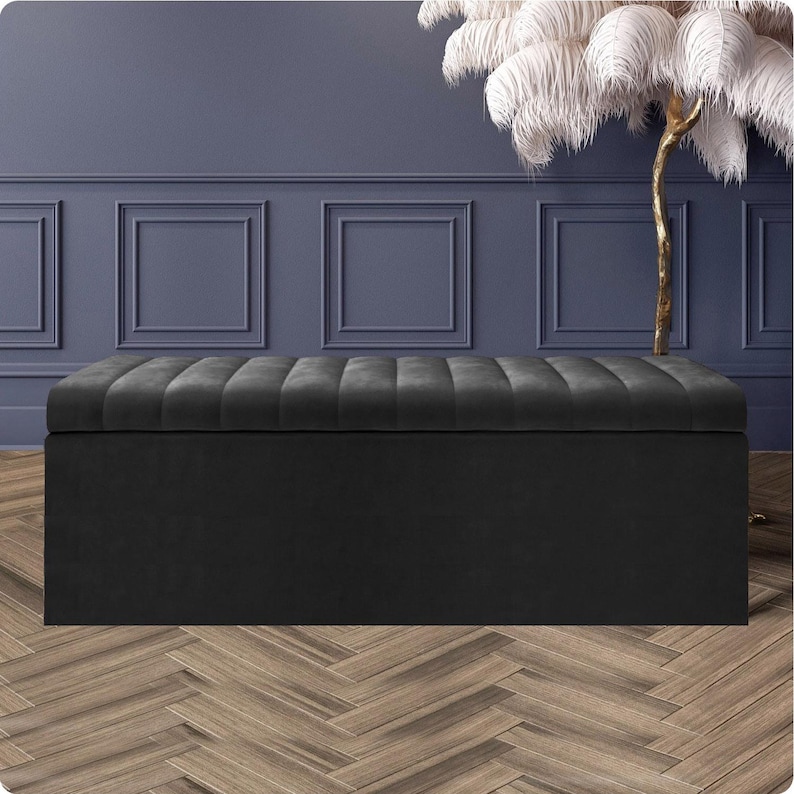 Handmade black velvet upholstered storage ottoman box with striped lined interior, soft-close lid, and deep storage compartment – perfect as end of bed bench, footstool, or coffee table, made to order in the UK.