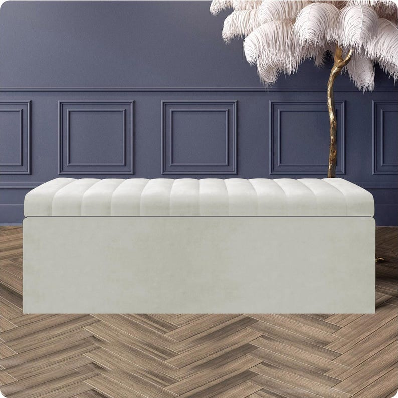Elegant cream velvet upholstered ottoman storage box with striped lining, soft-close lid and spacious compartment – luxury end of bed bench or footstool handmade in the UK.