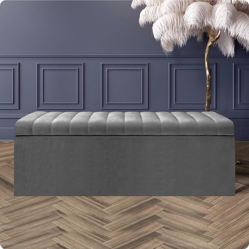 Grey velvet upholstered ottoman storage bench with lined interior and soft-close lid – versatile handmade footstool or end of bed ottoman UK.