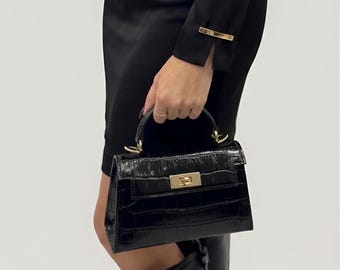 Zwarte Italiaanse leren minitas met krokodillenreliëf, portemonnee met gestructureerde bovenkant, elegante kleine crossbody
