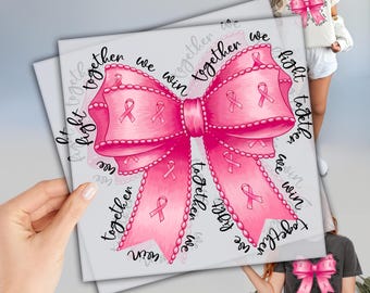 May include: A pink bow design with pink ribbons and the words "fight together we win" printed on a white background. The bow is the central focus, with the text arranged around it.
