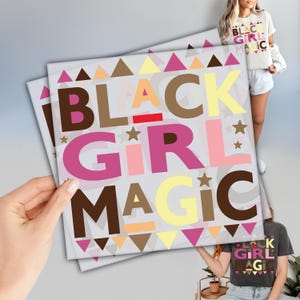 May include: A colorful print with the text "Black Girl Magic" in a bold, playful font. The text is surrounded by a pattern of brown, yellow, pink, and white triangles.