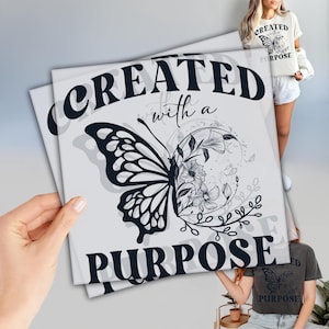 May include: A white background with black text that reads "Created with a Purpose" and a black and white butterfly with floral accents.