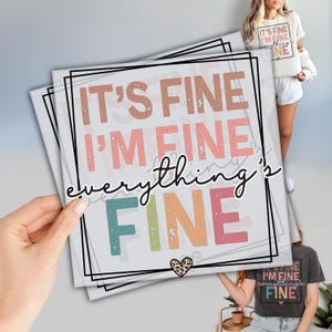 May include: A colorful graphic design with the text "IT'S FINE I'M FINE everything's FINE" in a distressed font. The text is in shades of pink, orange, yellow, green, and blue. There is a small heart with a leopard print pattern in the bottom right corner.