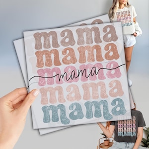 May include: A printable design featuring the word "mama" repeated five times in a retro font style. The text is in shades of pink, brown, and blue with a distressed, vintage look.