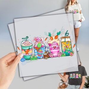 May include: A set of four colorful Easter-themed drinks with bunny ears, sprinkles, and candy. The drinks are in cups and jars with straws and are decorated with carrots and Easter eggs.