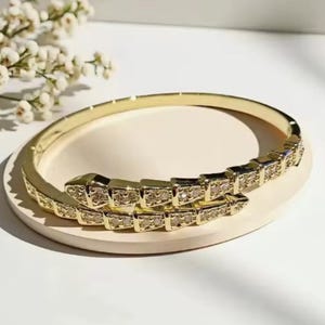 Gold snake bangle with Cz crystal