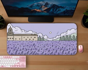 May include: A lavender-colored mousepad with a landscape illustration featuring a building, trees, and a field of lavender. A pink keyboard and mouse are also visible. The scene is set against a light purple sky with clouds and a full moon.