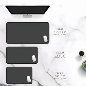 May include: Three black rectangular mouse pads in different sizes: large (31" x 15.5"), medium (22" x 12"), and small (18" x 12"). Each pad has a white mouse on the right side. A computer monitor is at the top.