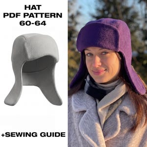 May include: A hat PDF pattern 60-64 + sewing guide featuring a light grey earflap hat on the left and a person wearing a purple earflap hat on the right. The hat has a rounded crown and side flaps that extend downwards to cover the ears.
