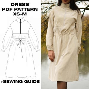 May include: A beige long-sleeve dress with a high collar, a front zipper, and a drawstring waist. The image includes a technical line drawing of the dress and the text DRESS PDF PATTERN XS-M +SEWING GUIDE, showing the design details clearly.