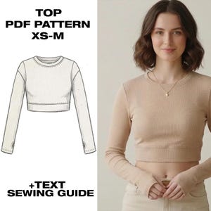 May include: A beige long-sleeve crop top with a ribbed texture, a crew neckline, and thumbhole cuffs. The image includes a technical sketch of the garment and text that reads TOP PDF PATTERN XS-M +TEXT SEWING GUIDE.