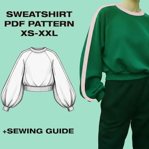 May include: A green sweatshirt with pink stripes on the sleeves and a white sweatshirt pattern. The text on the image reads "SWEATSHIRT PDF PATTERN XS-XXL" and "+SEWING GUIDE".