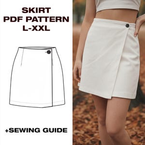 May include: A white wrap skirt with a button closure, shown on a person. The image also includes a line drawing of the skirt and text that reads "SKIRT PDF PATTERN L-XXL +SEWING GUIDE."