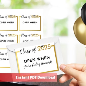 May include: A white envelope and cards with gold trim and the text "Class of 2025" and "Open When". The cards are for a graduation gift. Black and gold balloons are in the background.
