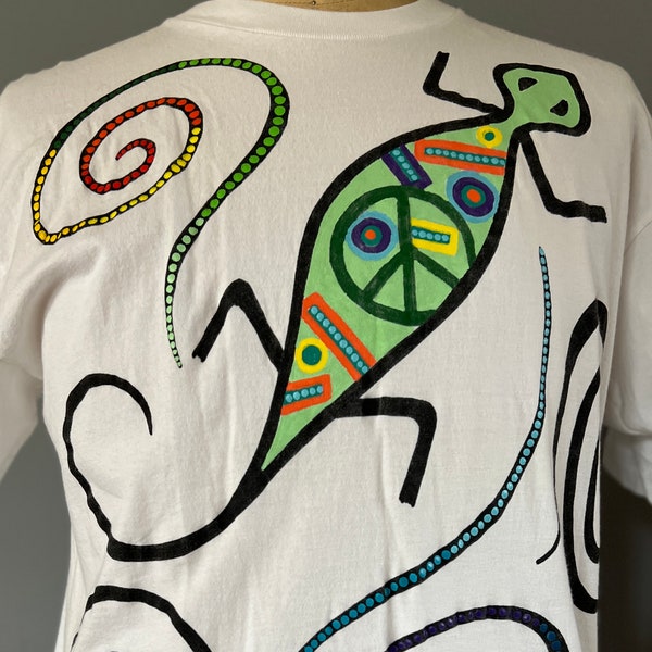 Hand painted t shirt Original design "Baskin in the sun" Contemporary South western look with lizard and iconic peace symbol