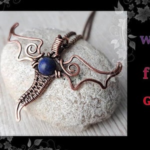 May include: DIY wire wrapping Dragon for beginners by GemSeeker Studio. A copper wire dragon pendant with a blue gemstone is shown on a white rock.