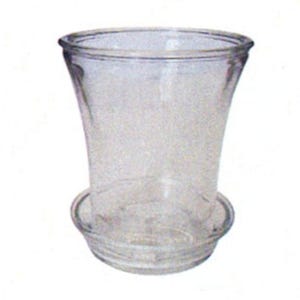 May include: A clear glass candle holder with a wide base and a flared top. The holder is designed to hold a pillar candle.