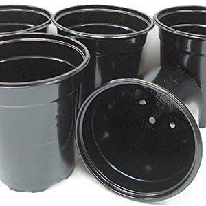 May include: Four black plastic plant pots of various sizes. The pots are all round and have a smooth, matte finish.
