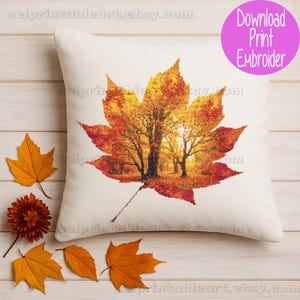 Romantic autumn forest landscape cross stitch inside a maple leaf design - Golden fall leaf embroidery pattern featuring a glowing woodland scene - Nature-inspired autumn decor – maple leaf cross stitch with forest sunlight - Rustic woodland fall embroidery, perfect for cozy seasonal wall art - Detailed maple leaf cross stitch pattern with a warm, romantic autumn theme
