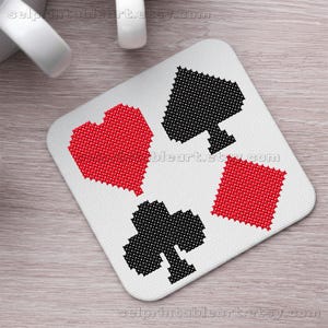 May include: A white square coaster featuring cross-stitched playing card suits: a red heart, a black spade, a red diamond, and a black club. The Etsy shop name "selprintableart.etsy.com" is printed on the coaster.
