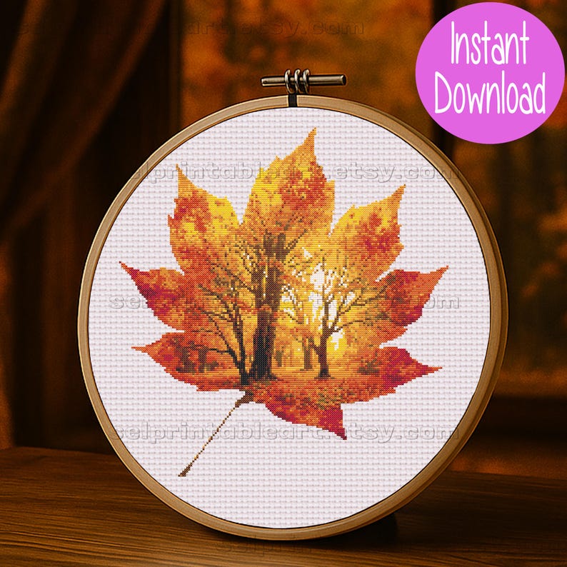 Romantic autumn forest landscape cross stitch inside a maple leaf design - Golden fall leaf embroidery pattern featuring a glowing woodland scene - Nature-inspired autumn decor – maple leaf cross stitch with forest sunlight - Rustic woodland fall embroidery, perfect for cozy seasonal wall art - Detailed maple leaf cross stitch pattern with a warm, romantic autumn theme