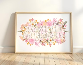 May include: A framed print featuring a watercolour illustration of pink and white flowers with green leaves. The text "Smash the Patriarchy" is written in white letters on the print.