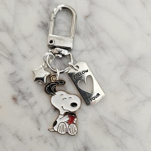 Charm Clip on Swivel Clasp Featuring Peanuts Snoopy with Silver or Gold Star and Affirmation Word