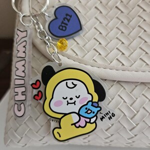 BT21 Charm Clip featuring Tata, RJ, Koya, Mang, Chimmy, Shooky Each with a Mini BT21 Friend, Name, Heart, Crystal Gem on Swivel Clasp