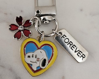Charm Clip am Drehverschluss mit Snoopy mit bunter Blume und positivem Wort