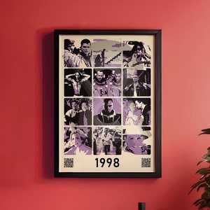 May include: A black framed poster featuring a collage of images from films released in 1998. The poster has a white background with a black border and the year "1998" printed in the centre.