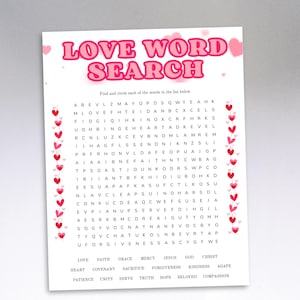 May include: A white paper with a pink and red "LOVE WORD SEARCH" title. The word search puzzle has a grid of letters with words to find, and a list of words below. Pink hearts decorate the border.