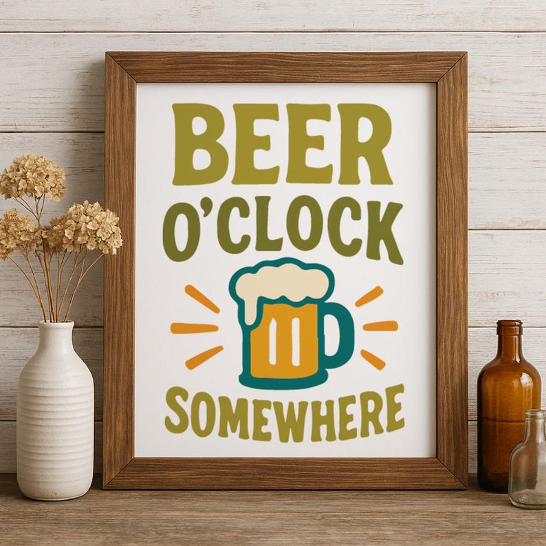 May include: A framed print with the words "BEER O'CLOCK SOMEWHERE" in green and yellow. The image includes a beer mug illustration with foam and radiating lines. The frame is brown, and the background is white.