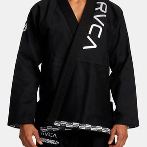 May include: Black Jiu-Jitsu Gi with white RVCA branding on the sleeve and a white RVCA logo on the bottom hem.