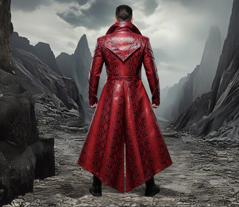 May include: A long, red coat with a snakeskin pattern. The coat features a wide collar and a belted waist. The person is standing with their back to the camera, in a rocky, mountainous landscape.