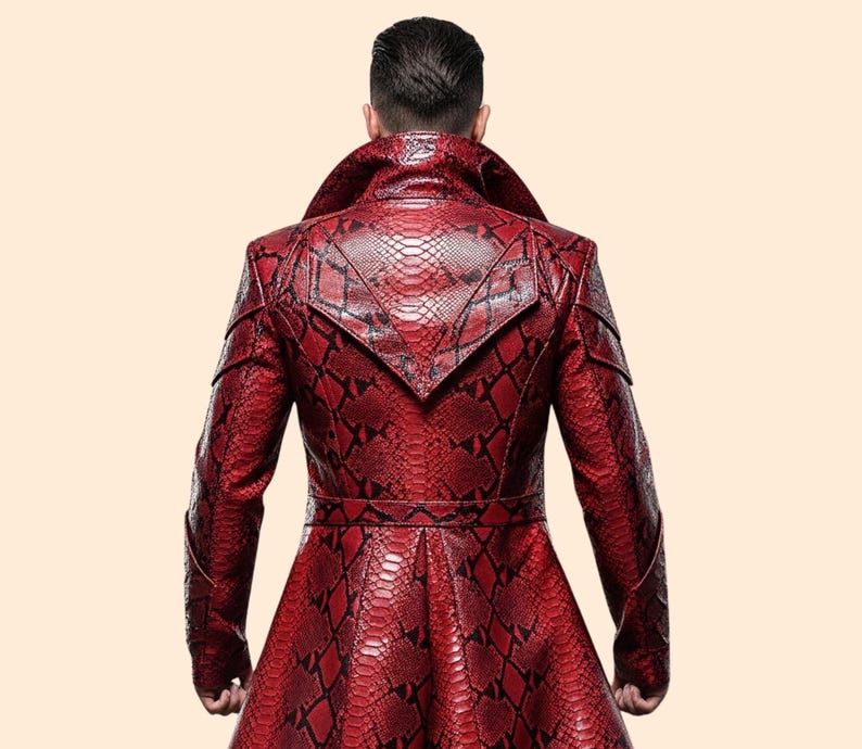 May include: A red snakeskin-patterned coat with a wide collar and a belt. The coat has a long, flowing design and is made of a textured material. The back of the coat is visible, showcasing the intricate pattern and tailoring.