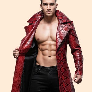 May include: A red, long leather coat with a snakeskin pattern. The coat has a wide collar and is open, revealing a black lining. The coat is worn with black jeans. The coat's design is eye-catching and bold.