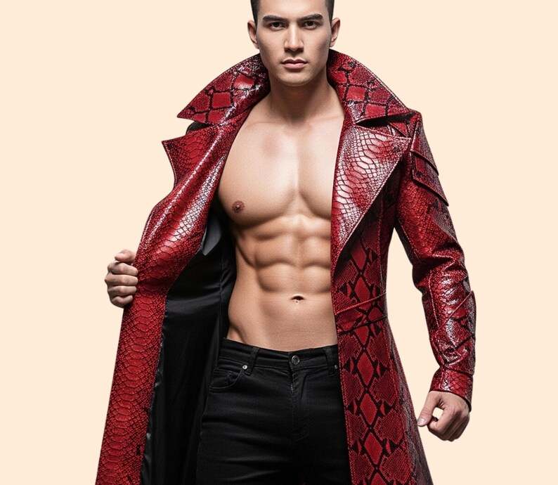 May include: A red, long leather coat with a snakeskin pattern. The coat has a wide collar and is open, revealing a black lining. The coat is worn with black jeans. The coat's design is eye-catching and bold.