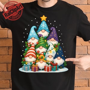 May include: Black t-shirt featuring a Christmas tree design made of gnomes with colorful hats and white beards. The tree is decorated with ornaments and topped with a gold star. Presents are at the base of the tree.