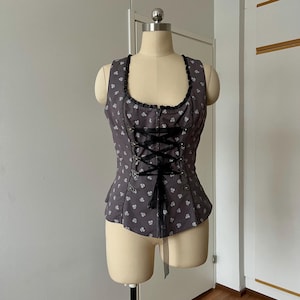 May include: A set of three ceramic mugs with a speckled, matte finish in cream, light brown, and dark brown. Each mug has a simple, minimalist design and a rounded handle. Ideal for tea or coffee.