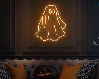 以下が含まれることがあります： 暗い壁にオレンジ色のネオンの幽霊のサイン。ハロウィーンの装飾が施されており、カボチャやコウモリのシルエットがあります。サインはNeon Deckからです。
