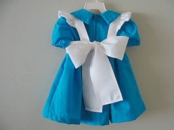 Girl blue dress with White apron for birthday theme idea