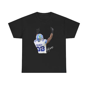 May include: Black t-shirt with a white and blue football player image and the text "BRANCH 82" and a signature.