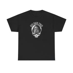 May include: Black t-shirt with a graphic design. The design features a stylized skull with a face inside and the words "STU YOUR FACE" in a circular arrangement. The graphic is in black and white.