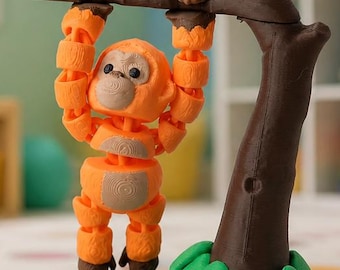May include: An articulated orange orangutan figure with a light brown face and chest, hanging by its hands from a brown 3D-printed tree branch. The tree features a dark brown trunk and base with bright green leaves at the bottom of the structure.