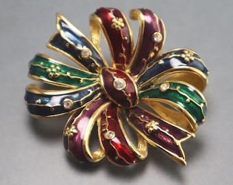 Joan Rivers strikbroche emaille strassteentjes vintage pin
