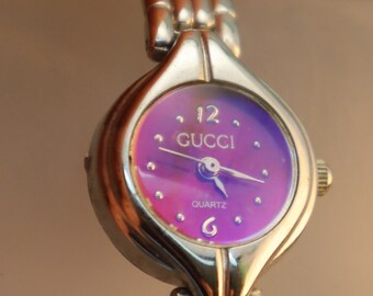 Vintage Gucci horloge reflecterend paars roze wijzerplaat damespolshorloge