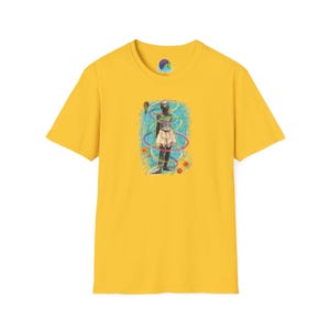 May include: A yellow t-shirt featuring a colorful graphic. The graphic depicts a figure surrounded by swirling lines and circles. The shirt has a crew neck and short sleeves. A small logo is visible on the upper chest.