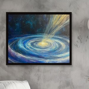 May include: A painting of a galaxy with a bright yellow light in the center. The galaxy is blue and purple with a dark blue background. The painting is framed in black.